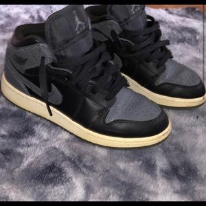 Black and grey Jordan 1s